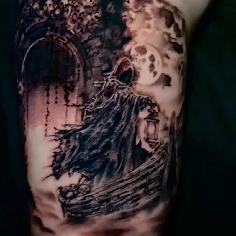 Black and grey tattoo of a hooded reaper walking past a skull-lined archway toward a full moon, with a small boat below, on the inner arm.